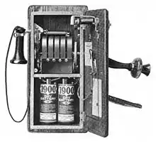 Image 201917 wall telephone, open to show magneto and local battery (from History of the telephone)