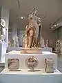 Marble cult statue of Aphrodite Hypolympidia and votive offerings