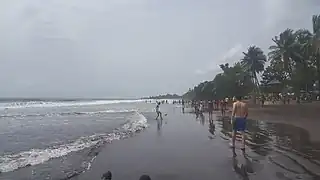 Image 2Limbe Beach with people engaging in various activities (from Tourism in Cameroon)
