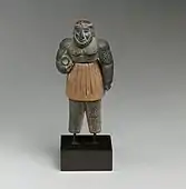 Monstrous male figure; late 3rd–early 2nd millennium BC; chlorite, calcite, gold and iron; height: 10.1 cm; Metropolitan Museum of Art