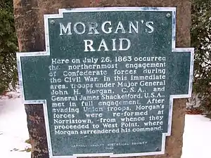 aluminum plaque bolted to sandstone. Plaque is shape of outline of Carroll County, Ohio, with raised letters that read: "MORGAN'S RAID Here on July 26, 1863 occurred the northernmost engagement of Confederate forces during the Civil War. In this immediate area, troops under Major General John H. Morgan, C.S.A., and General James Shackleford, U.S.A., met in full engagement. After evading Union troops, Morgan's forces were re-formed at Norristown, from whence they proceeded to West Point, where Morgan surrendered his command.  CARROLL COUNTY HISTORICAL SOCIETY 1969"
