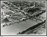 Image 20An aerial view of Murray Bridge in 1953 showing rail and road bridges, and also paddle steamers. (from Transport in South Australia)