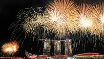 Image 12Fireworks over the Marina Bay skyline following the conclusion of the 2015 National Day Parade on 9 August 2015. (from History of Singapore)