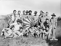 Image 5New Guinea Volunteer Rifles with captured Japanese flag, 1942 (from History of Papua New Guinea)