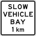 (A42-4/IG-9) Slow Vehicle Bay Ahead (in 1 kilometre)