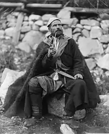 Old peasant with khanjali dagger and long smoking pipe, Mestia, Svaneti, Georgia