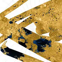 High-resolution false-color Cassini synthetic aperture radar mosaic of Titan's north polar region, showing hydrocarbon seas, lakes and tributary networks. Blue coloring indicates low radar reflectivity areas, caused by bodies of liquid ethane, methane and dissolved nitrogen. About half of Kraken Mare, the large body at lower left, is outside the image. Ligeia Mare is the large body at lower right. Punga Mare is just left of center. Jingpo Lacus is just above Kraken Mare, and Bolsena Lacus is directly above it.