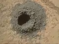 "Windjana" sandstone on Mars - drill hole (1.6&nbsp;cm (0.63&nbsp;in)) made by Curiosity (Kimberley; April 29, 2014).