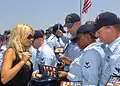 Image 13Playmate of the Year and People for the Ethical Treatment of Animals spokesperson Pamela Anderson, signing DVDs at the USS Halsey