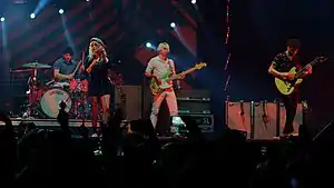 (L–R): Zac Farro, Hayley Williams, touring member Joey Howard, and Taylor York performing in 2018