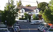 "Main Street, Raheny, with old schoolhouse turned restaurant"