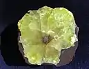 Sliced prehnite fragment with calcite core, 9.0&nbsp;cm diameter.