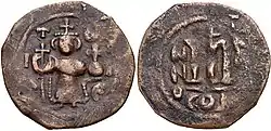 Coin of the Rashidun Caliphate with figure of Constans II standing facing, holding cross-tipped staff and globus cruciger. Pseudo-Byzantine types. Struck circa 647–670.
