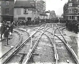 The cross-over at the junction of Broad Street, St. Mary's Butts, Oxford Road and West Street, looking westwards along Oxford Road, 1903. The rails are in place, but not yet filled in with cobble-stones.