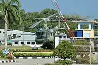 Retired RBAirF Bell UH-1 (Bell 212) helicopter gate guardian displayed inside the main gate of the airbase, September 2023.