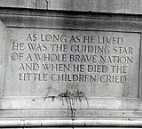 Inscription on the stone base, left side