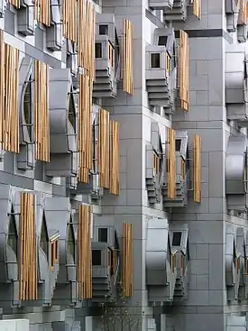 Image 12The Scottish Parliament Building (Scottish Gaelic: Pàrlamaid na h-Alba, Scots: Scots Pairlament Biggin) is the home of the Scottish Parliament at Holyrood, within the UNESCO World Heritage Site in central Edinburgh. It was designed by Enric Miralles, the Catalan architect,.and has won a number of awards, including an award at the VIII Biennial of Spanish Architecture, the RIAS Andrew Doolan Award for Architecture, and the 2005 Stirling Prize, the UK's most prestigious architecture award.Photo credit: Wangi