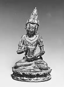 Deity holding a cuirass, from earlier, 10–11th century, Nganjuk, East Java