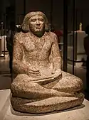 Seated portrait statue of Dersenedj, scribe and administrator; circa 2400 BC; rose granite; height: 68&nbsp;cm; from Giza; Egyptian Museum of Berlin