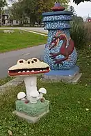 Two of Boyum's sculptures, Man-Eating Mushroom and Blue Urn with Dragon in Jackson Square in Madison, Wisconsin