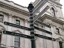 Image 10A signpost on Parliament Square with directions for nearby attractions (from Tourism in London)