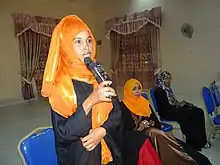 Image 53Somali woman in Hargeisa opening speech with traditional greeting. (from Culture of Somalia)