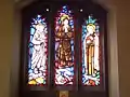 Stained glass west window depicting Mother Teresa, Edith Stein and Thérèse of Lisieux