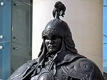 Statue of a warrior wearing a helmet