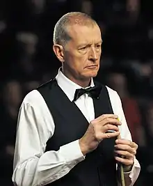 Steve Davis chalking his cue stick.
