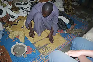 Image 2A textile artisan at work in Djenne, Mali. (from Culture of Mali)