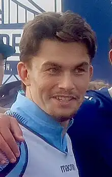 Man in a football jersey smiling