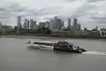 A Thames Clipper by Canary Wharf, taken from next to the Greenwich foot tunnel. June 2022.