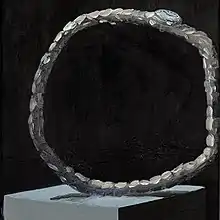 A dramatically widened hand watch.