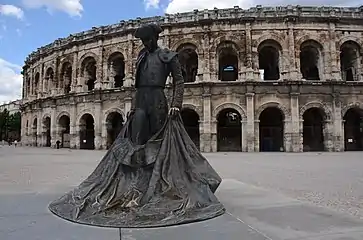 The statue of Christian Montcouquiol, known as Nimeño II. The Nimes Arena is still used for bullfighting