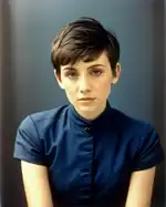 AI-generated woman with a short pixie cut, 2023