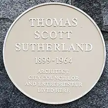 A circular commemorative plaque bearing the inscription 'Thomas Scott Sutherland 1899 - 1964 Architect, City Councillor and Entrepreneur lived here.'