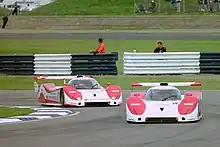 The Jan Lammers/Andy Wallace Toyota TS010 leads the example of Geoff Lees/Hitoshi Ogawa at the 1992 FIA WSC round at Silverstone.