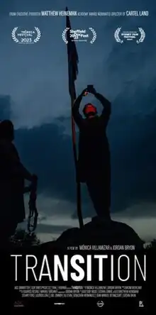 Movie poster with a photo of two people, one with a rifle and the other with a phone, standing by a flag at night. Superimposed are the title of the film and the credits.