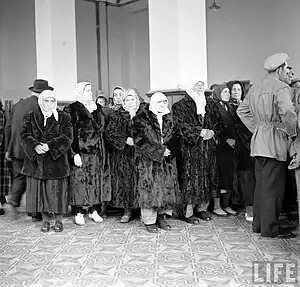 Turkish women at the Edirne Station in 1950. They were only allowed to bring their clothing, which is why most women bought a fur coat to retain some of their assets. According to the LIFE report "Bulgarian Communists usually find ways to steal peasants' money and land before letting them go.