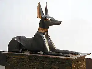 The Anubis Shrine; 1336–1327&nbsp;BC; painted wood and gold; 1.1 × 2.7 × 0.52&nbsp;m; from the Valley of the Kings; Egyptian Museum (Cairo)