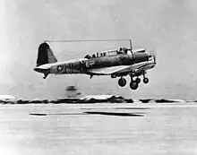Two Vought SB2U-3 Vindicators of VMSB-241 take off from Midway Atoll. Plane No. 6 in the foreground (BuNo 2045) was flown on June 4, 1942 by 2nd Lt James H. Marmande with PFC Edby Colvin as gunner. This plane was flown in the morning attack against the Japanese and disappeared on the night of 4/5 June about 16 km (10 mi) from Midway.
