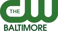 The CW network logo in green with the word "Baltimore" beneath in darker green.