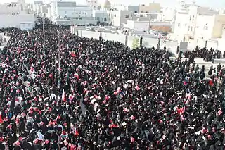 Women taking part in a pro-democracy sit-in in Sitra