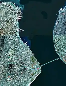 A satellite view of the Narrows with Staten Island (on the left) and Brooklyn (on the right) connected by the Verrazzano-Narrows Bridge